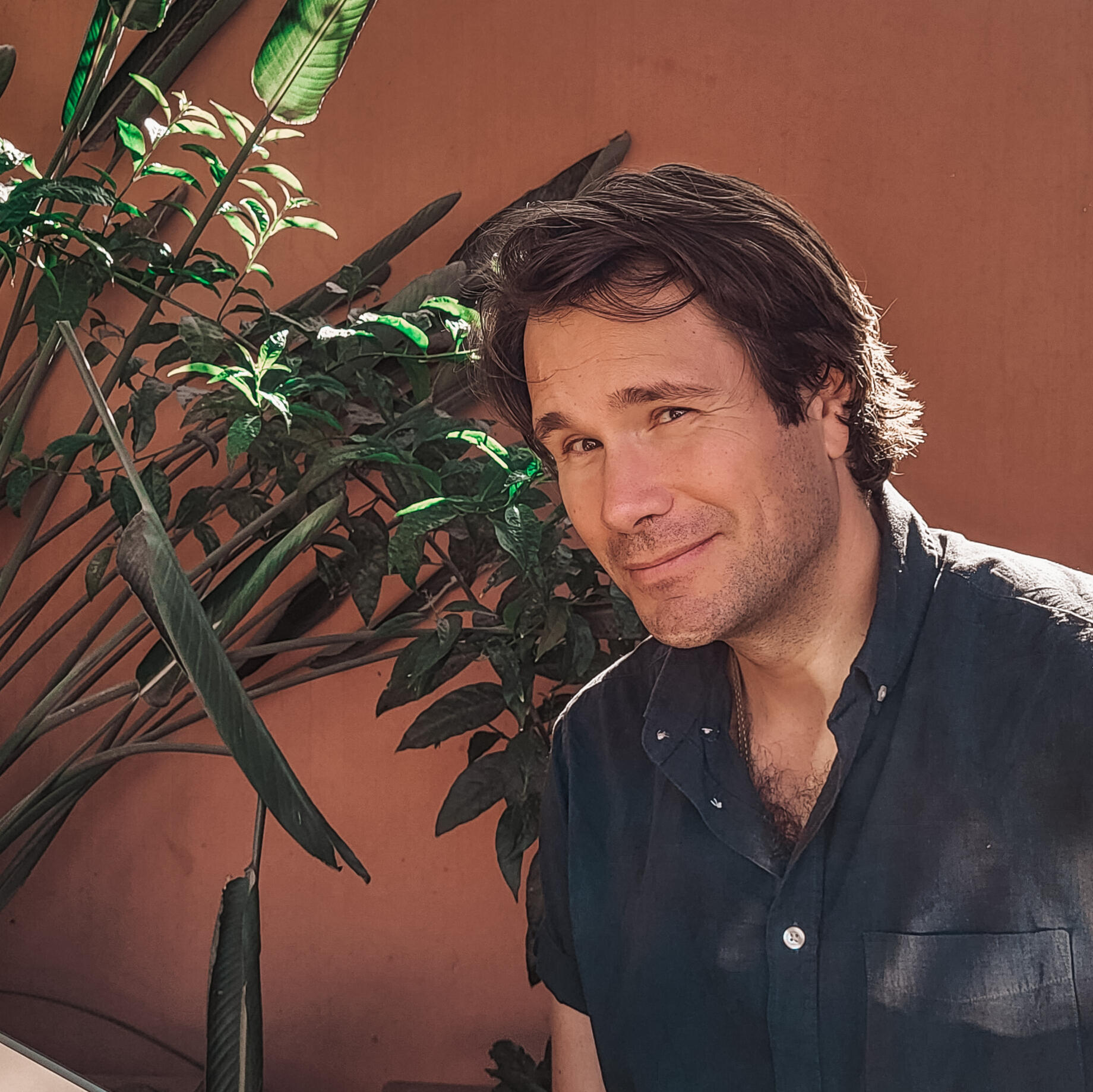 Adam Kawalec life and business coach from Comfort Zone Advantage Man with brown hair looking into camera smiling